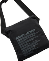 A black shoulder bag with a wide padded front pocket printed with the text 'ROMO JACKET' and smaller descriptive text in a light gray tone, shown on a plain white background.