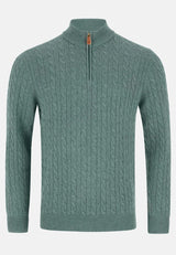 Green cable knit sweater with a zipper on a white background