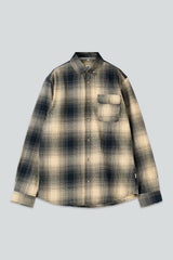 A long-sleeve button-up plaid shirt in beige and dark navy, laid flat against a light gray background.