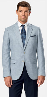Man wearing a light blue suit with a patterned tie on a white background