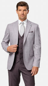 Man wearing a blush suit with a white shirt and tie on a white background
