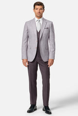 Man wearing a bordo suit with a white shirt and black shoes on a white background