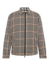 A long-sleeve zip-up jacket featuring a navy, beige, and brown houndstooth pattern, displayed on a clean white background.