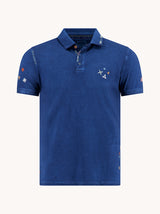 Blue polo shirt with small designs on a white background