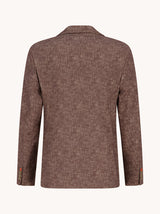 A brown textured blazer shown from the back, featuring a subtle woven pattern and classic collar, set against a solid off-white background.