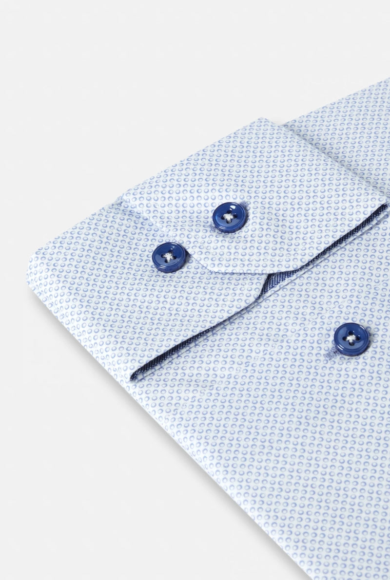 Close-up of a light blue textured shirt with buttons on a white background