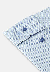 Close-up of a patterned shirt with buttons on a light background
