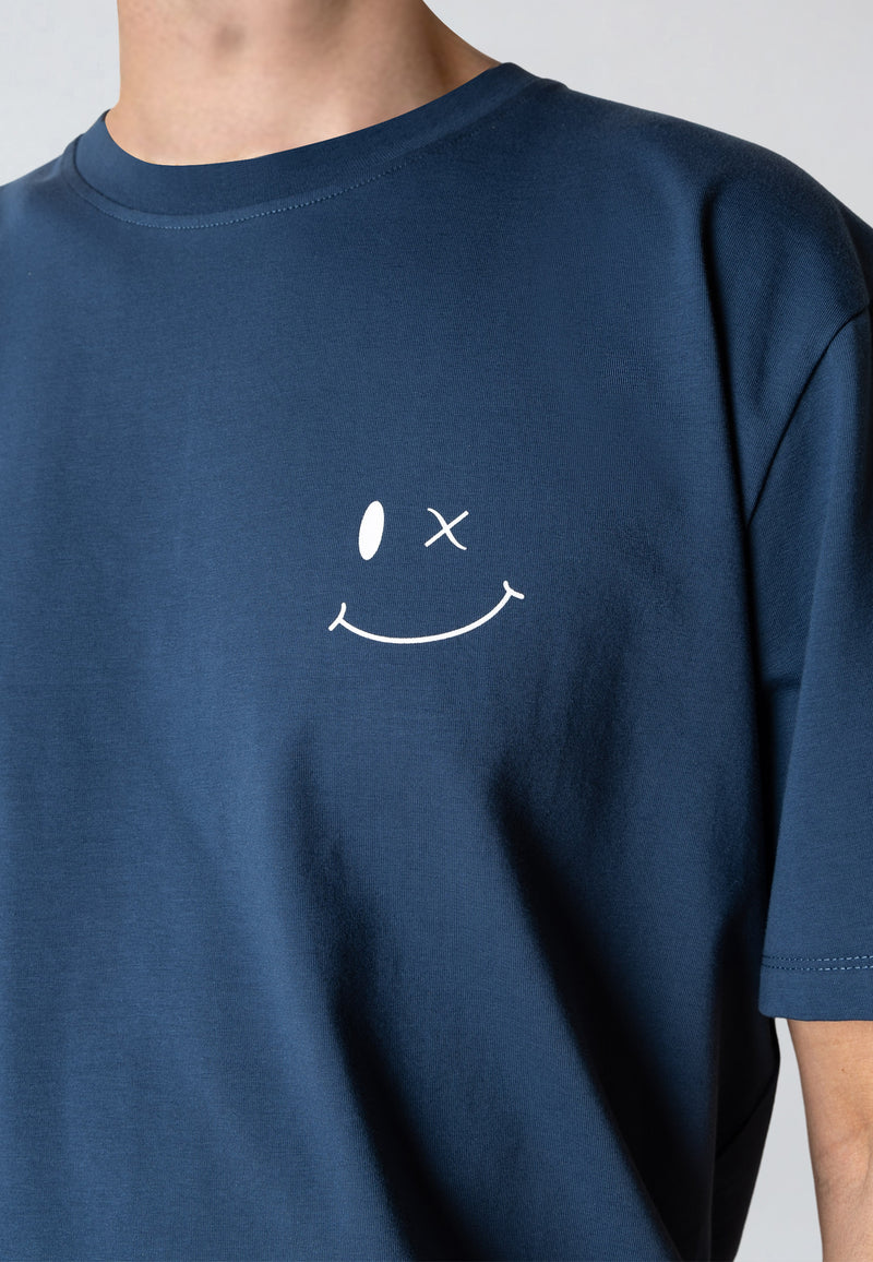 Navy blue t-shirt with a white smiley face design on a plain background