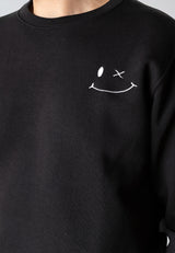 Black sweatshirt with a white smiley face design on the chest