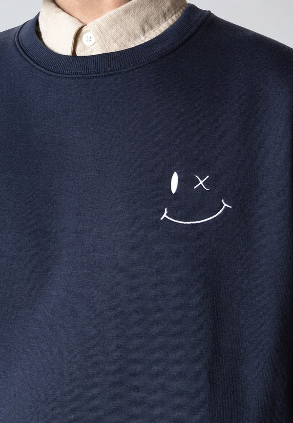 Navy blue sweatshirt with a white smiley face design on a plain background