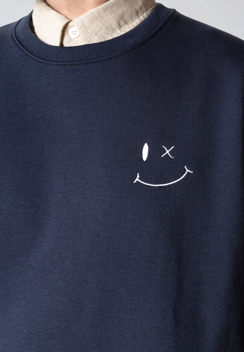 Navy blue sweatshirt with a white smiley face design on a plain background
