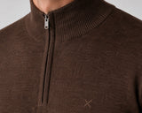 Close-up of a brown ribbed knit half-zip sweater with a stand collar and a small embroidered cross logo on the chest.