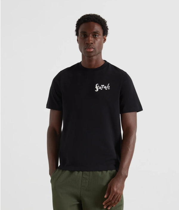 Person wearing a black t-shirt with a logo on a white background