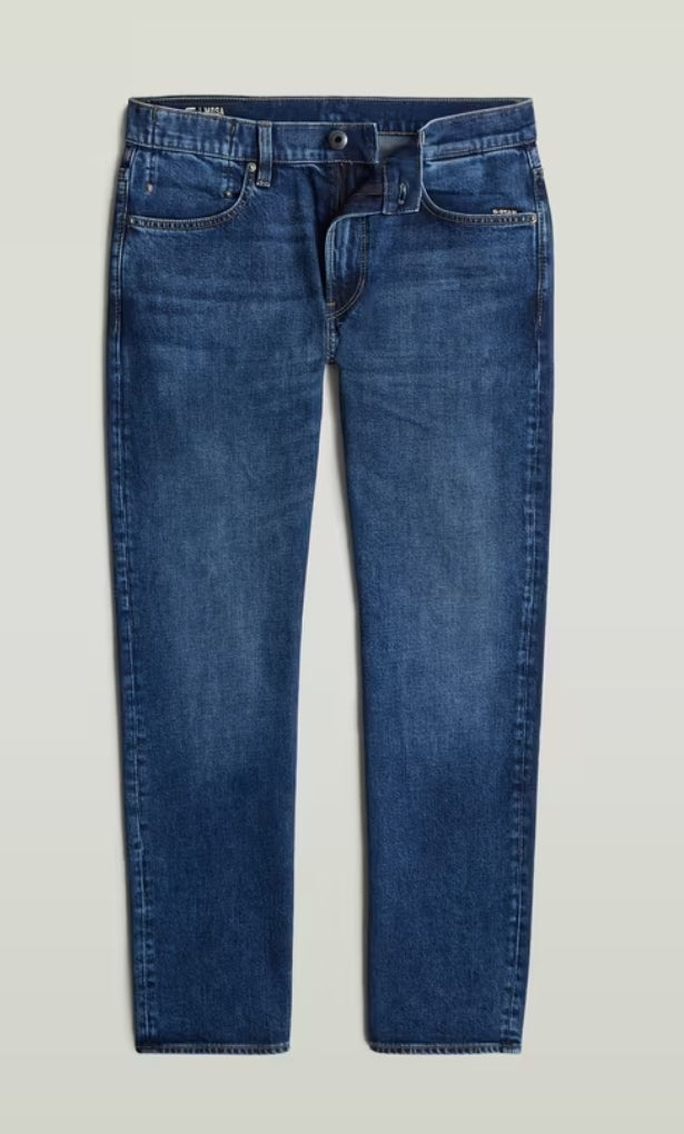 Blue jeans on a light gray background