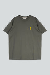 A dark olive green crewneck t-shirt with a small yellow anchor logo embroidered on the left chest, displayed flat against a light gray background.
