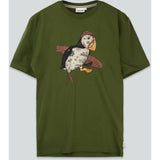 An olive green short-sleeve t-shirt featuring a graphic illustration of a puffin wearing a pirate hat and holding a pipe, set against a plain light gray background.