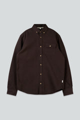 Brown shirt with button details on a light gray background