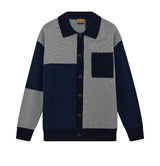 Gray and navy color-blocked sweater with button details on a white background