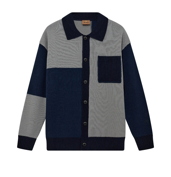 Gray and navy color-blocked sweater with button details on a white background