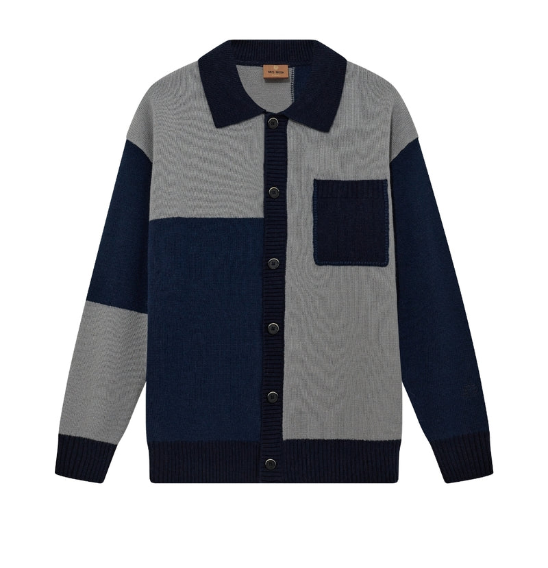 Gray and navy color-blocked sweater with button details on a white background