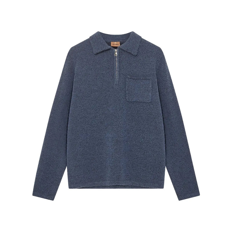 Blue long-sleeve shirt with a collar and pocket on a white background
